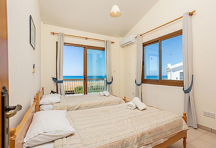 Twin bedroom with A/C, sea views, and balcony access . - Blue Bay Villa Dimitris . (Photo Gallery) }}