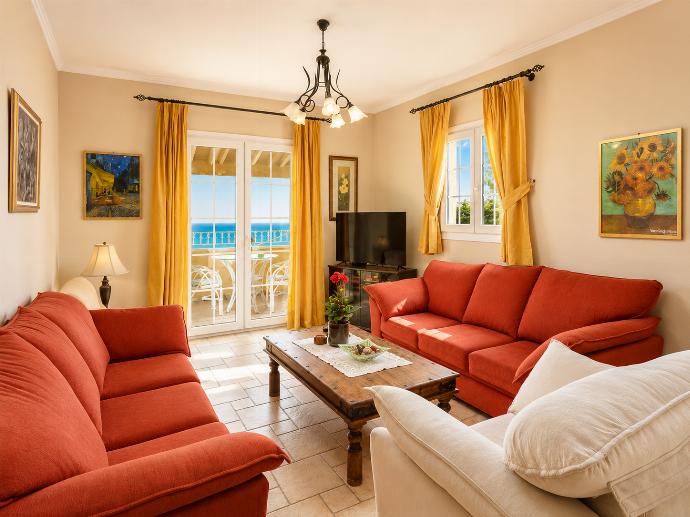 Living room on first floor with sofas, WiFi internet, satellite TV, and balcony access . - Ioannas House . (Photo Gallery) }}