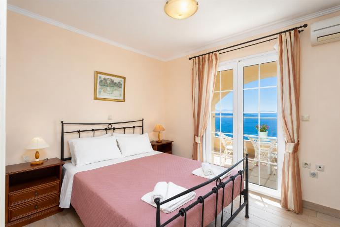Double bedroom on ground floor with A/C, sea views, and terrace access . - Ioannas House . (Photo Gallery) }}