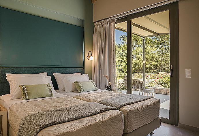 Bedroom with terrace entry and A/C . - Villa Sunrise . (Photo Gallery) }}