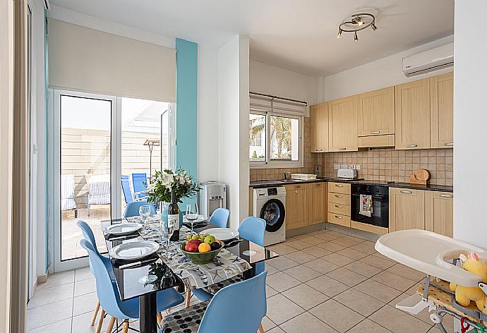 Equipped kitchen and dining area with A/C . - Villa Vitamin Blue . (Photo Gallery) }}