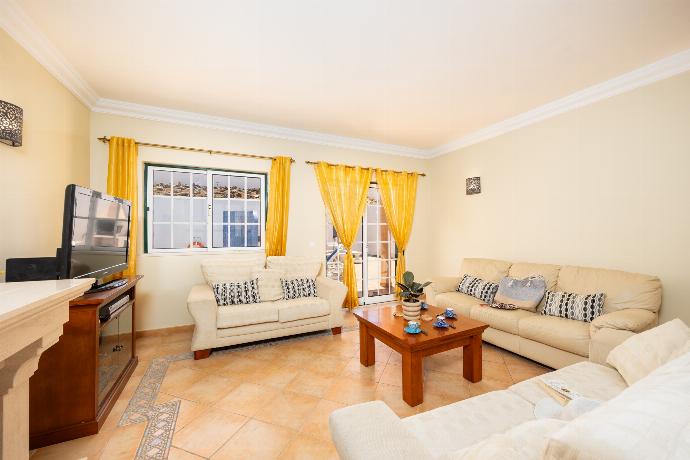 Open-plan living room with sofas, dining area, ornamental fireplace, A/C, WiFi internet, and satellite TV . - Villa Santa Maria . (Photo Gallery) }}