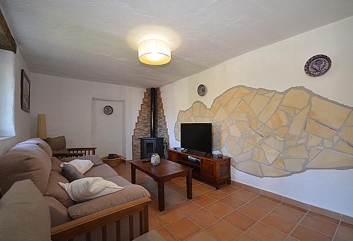 Living room with sofas and TV . - Villa Cortijo Mar . (Photo Gallery) }}