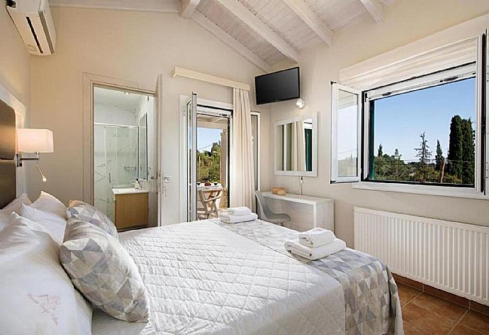 Double bedroom with A/C  . - Villa George . (Photo Gallery) }}