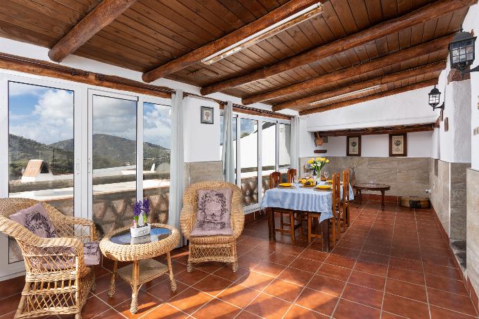 Sun room with dining area, seating, and mountain views . - Villa Jardin . (Photo Gallery) }}