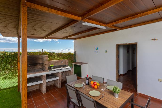 Sheltered terrace area with BBQ . - Villa Cortijo Romero . (Photo Gallery) }}