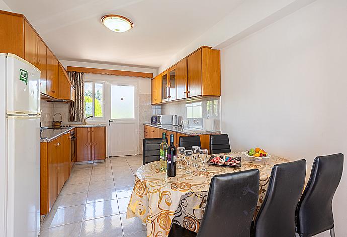 Equipped kitchen with dining area . - Villa Sotiroula . (Photo Gallery) }}