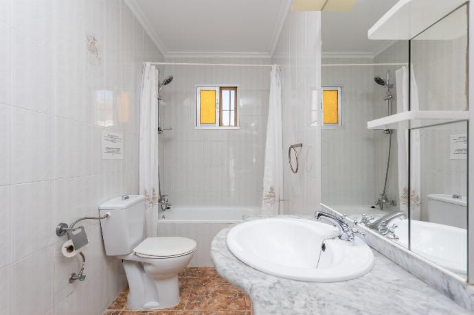 Family bathroom with bath and shower . - Villa Rayao . (Photo Gallery) }}