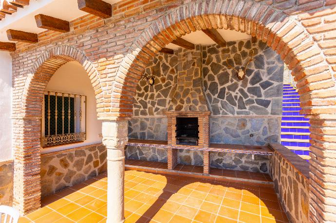 Sheltered terrace area with BBQ . - Villa El Pedregal . (Photo Gallery) }}