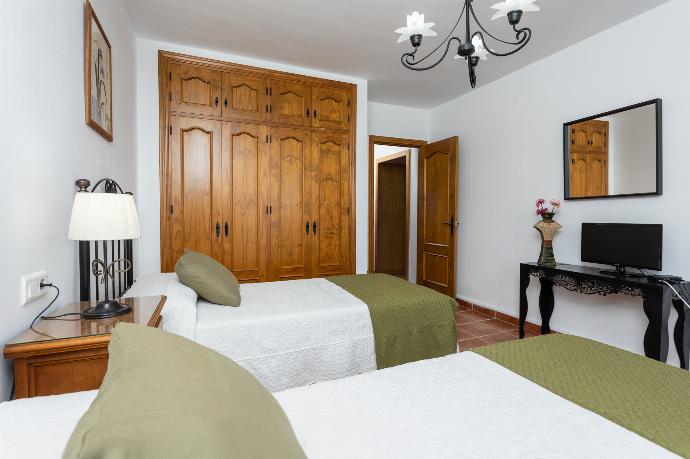 Twin bedroom with A/C . - Villa Flores . (Photo Gallery) }}