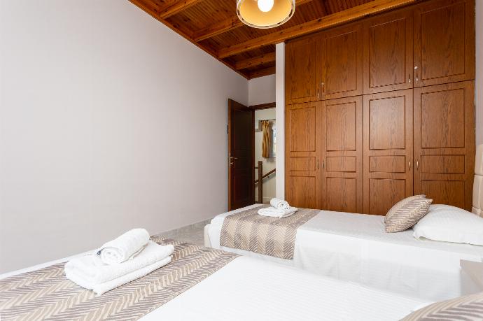 Twin bedroom on first floor with sea views and balcony access . - Villa Sunrise . (Галерея фотографий) }}