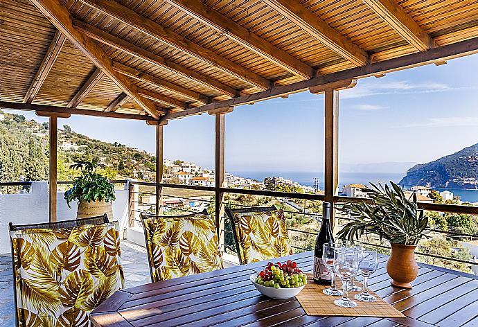 Terrace with dining table and sea view  . - Villa Aloupi . (Photo Gallery) }}