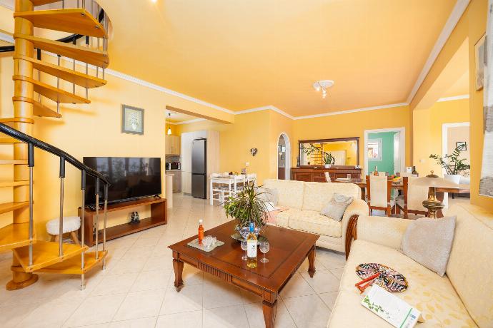 Ground floor: open-plan living room with sofas, dining area, kitchen, A/C, WiFi internet, satellite TV, and sea views . - Villa Spartera . (Photo Gallery) }}