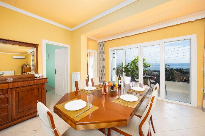 Ground floor: open-plan living room with sofas, dining area, kitchen, A/C, WiFi internet, satellite TV, and sea views . - Villa Spartera . (Photo Gallery) }}