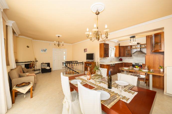 First floor: open-plan living room with sofa, dining area, kitchen, ornamental fireplace, A/C, WiFi internet, satellite TV, and sea views . - Villa Spartera . (Photo Gallery) }}