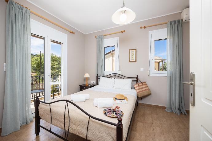 Double bedroom with A/C . - Villa Chloe . (Photo Gallery) }}