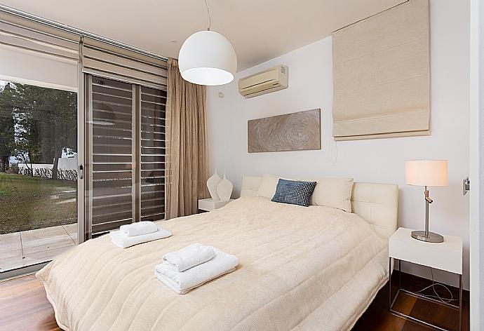 Double bedroom on ground floor with A/C and terrace access . - Annabel Beach Palace . (Photo Gallery) }}