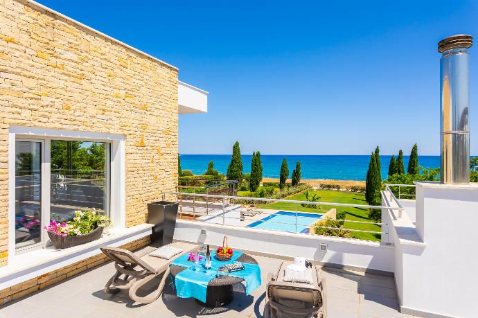 Upper terrace area with panoramic sea views . - Annabel Beach Palace . (Photo Gallery) }}
