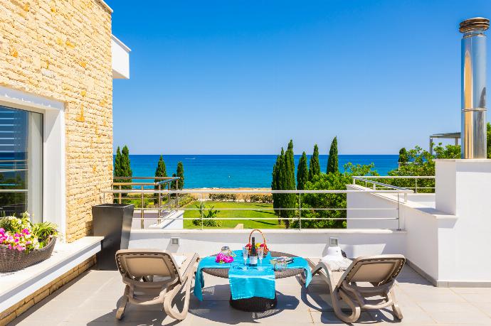 Upper terrace area with panoramic sea views . - Annabel Beach Palace . (Fotogalerie) }}