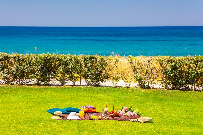 Garden area with panoramic sea views . - Annabel Beach Palace . (Photo Gallery) }}