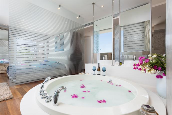 En suite bathroom with jacuzzi and shower . - Annabel Beach Palace . (Photo Gallery) }}
