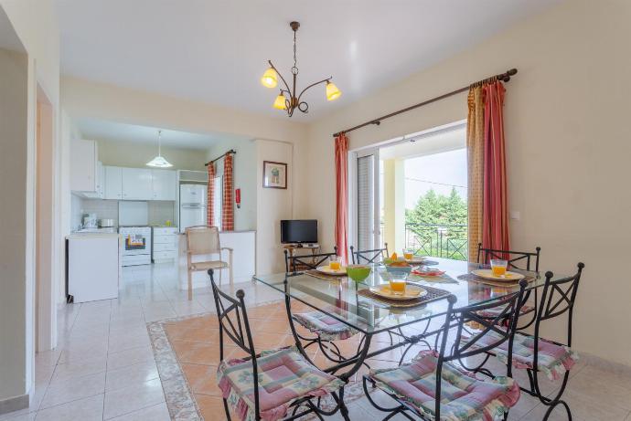 Well equipped kitchen and indoor dining area . - Ionian Sea Villas . (Photo Gallery) }}