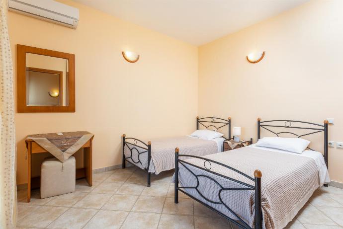 Twin bedroom with en suite bathroom, A/C, sea views, and terrace access . - Fiscardo Villas Collection . (Photo Gallery) }}