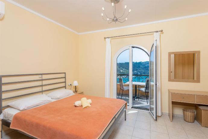 Double bedroom with A/C and sea views . - Lakka Bay View Collection . (Photo Gallery) }}