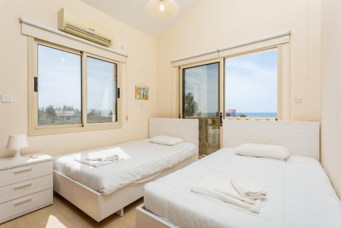 Twin bedroom with A/C, sea views, and balcony access . - Rose Villas Collection . (Fotogalerie) }}