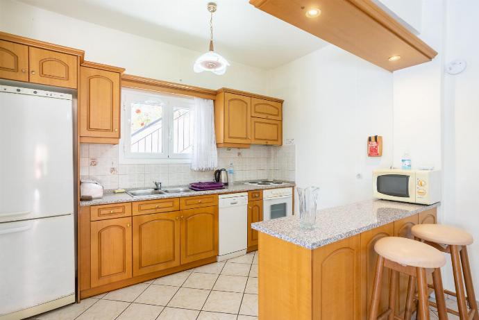 Equipped kitchen . - Nissaki Villas Collection . (Fotogalerie) }}