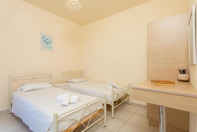 Twin bedroom with en suite bathroom, A/C, and upper terrace access with panoramic sea views . - Lourdas Villas Collection . (Galleria fotografica) }}