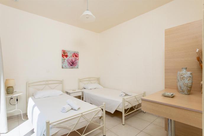 Twin bedroom with en suite bathroom, A/C, and upper terrace access with panoramic sea views . - Lourdas Villas Collection . (Galleria fotografica) }}