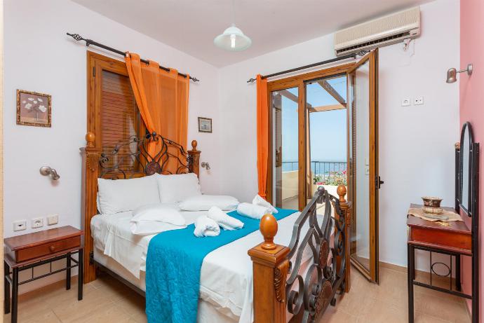 Double bedroom with A/C and balcony access . - Maroulas Villas Collection . (Photo Gallery) }}