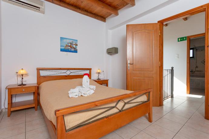 Double bedroom with A/C and balcony access . - Spiros Villas Collection . (Photo Gallery) }}