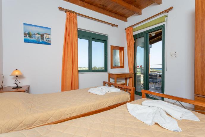 Twin bedroom with A/C and balcony access . - Spiros Villas Collection . (Photo Gallery) }}