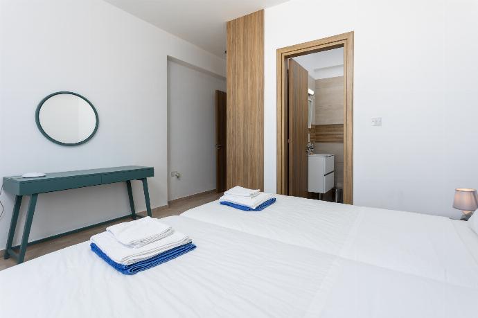 Twin bedroom with en suite bathroom, A/C, and sea views . - Villa Diana Seaside . (Photo Gallery) }}