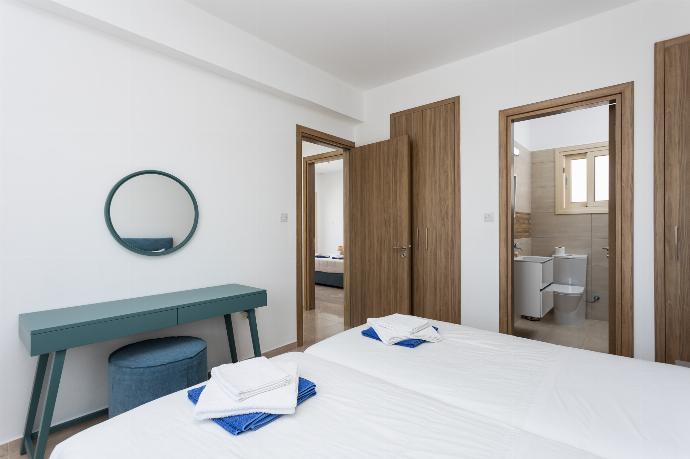 Twin bedroom with en suite bathroom and A/C . - Villa Diana Seaside . (Photo Gallery) }}
