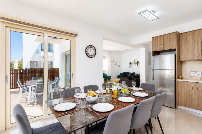 Open-plan living room with sofas, dining area, kitchen, A/C, WiFi internet, satellite TV, and sea views . - Villa Diana Seaside . (Γκαλερί Φωτογραφιών) }}