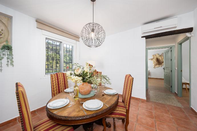 Open-plan living room with sofa, dining area, kitchen, ornamental fireplace, A/C, WiFi internet, and satellite TV . - Villa Tinao . (Photo Gallery) }}