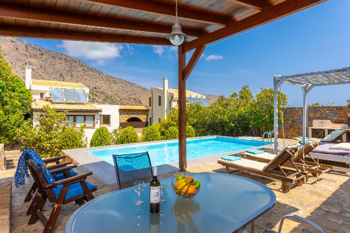 Sheltered terrace area . - Villa Elounda Plaka . (Photo Gallery) }}