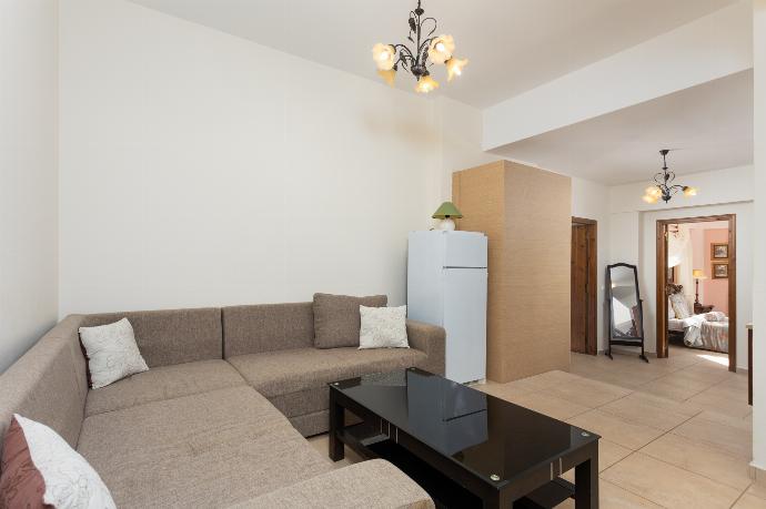 Living area with sofa and kitchenette  . - Villa Elounda Plaka . (Photo Gallery) }}