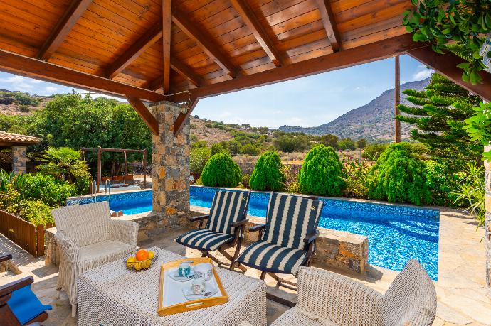 Sheltered terrace area . - Villa Elounda Blue . (Photo Gallery) }}