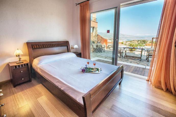 Double bedroom with A/C and terrace access . - Villa Glan Y Mor . (Photo Gallery) }}