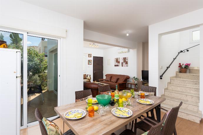 Open-plan living room with sofas, dining area, kitchen, A/C, WiFi internet, and satellite TV . - Villa Kalliopi . (Photo Gallery) }}