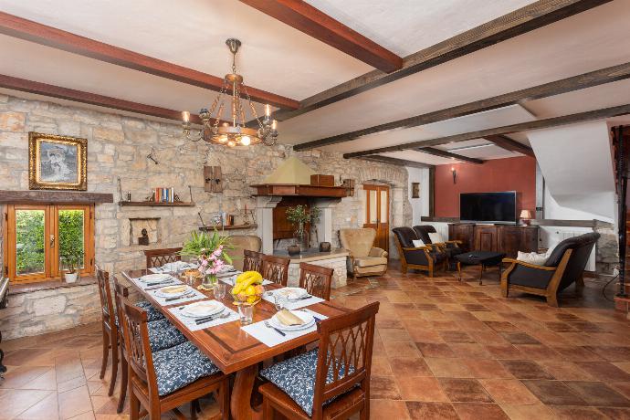 Living room on ground floor with sofas, dining area, ornamental fireplace, WiFi internet, and satellite TV . - Villa Di Vino . (Photo Gallery) }}