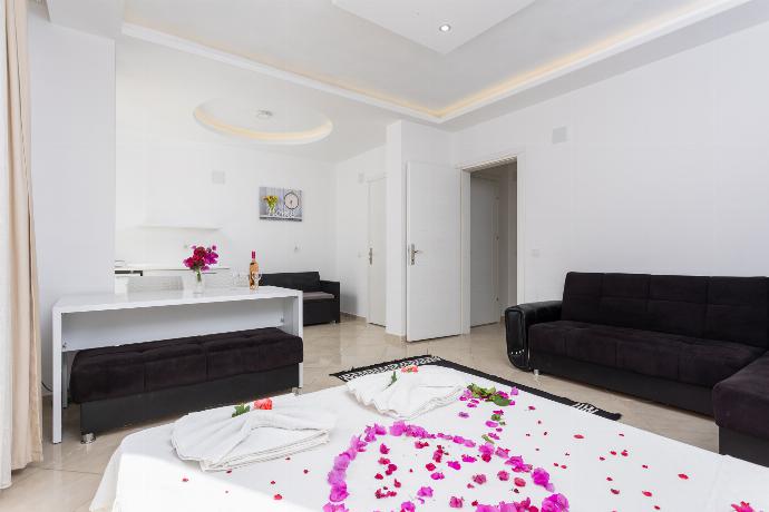 Double bedroom with A/C, kitchenette, sofa, and TV . - Villa Casa Mia . (Photo Gallery) }}