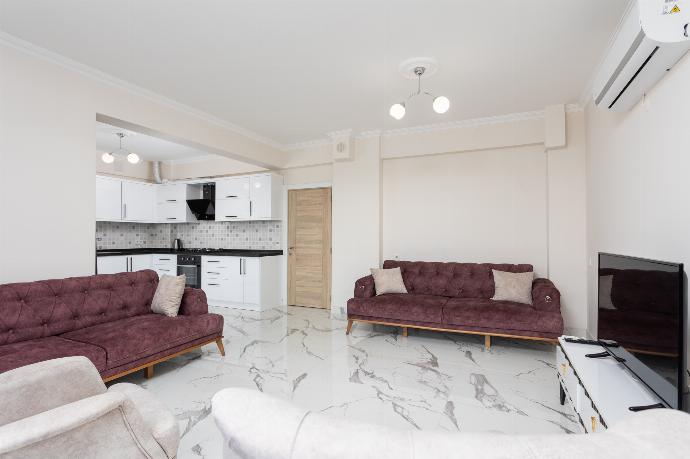 Open-plan living room with sofas, kitchen, A/C, WiFi internet, and satellite TV . - Villa Azalea 1 . (Photo Gallery) }}