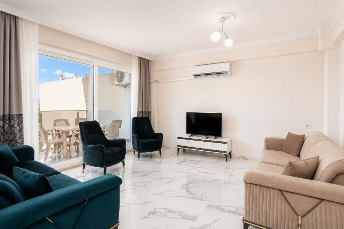 Open-plan living room with sofas, kitchen, A/C, WiFi internet and satellite TV . - Villa Azalea 2 . (Photo Gallery) }}