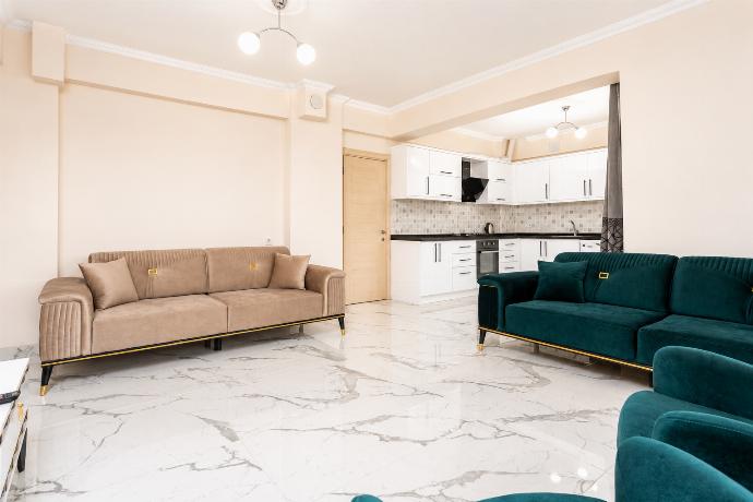 Open-plan living room with sofas, kitchen, A/C, WiFi internet and satellite TV . - Villa Azalea 2 . (Photo Gallery) }}