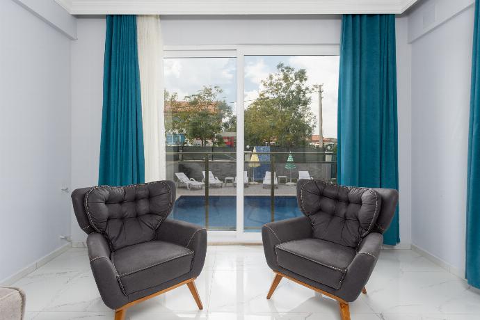 Living room with sofas, A/C, WiFi internet, and satellite TV . - Villa Sasha 3 . (Photo Gallery) }}